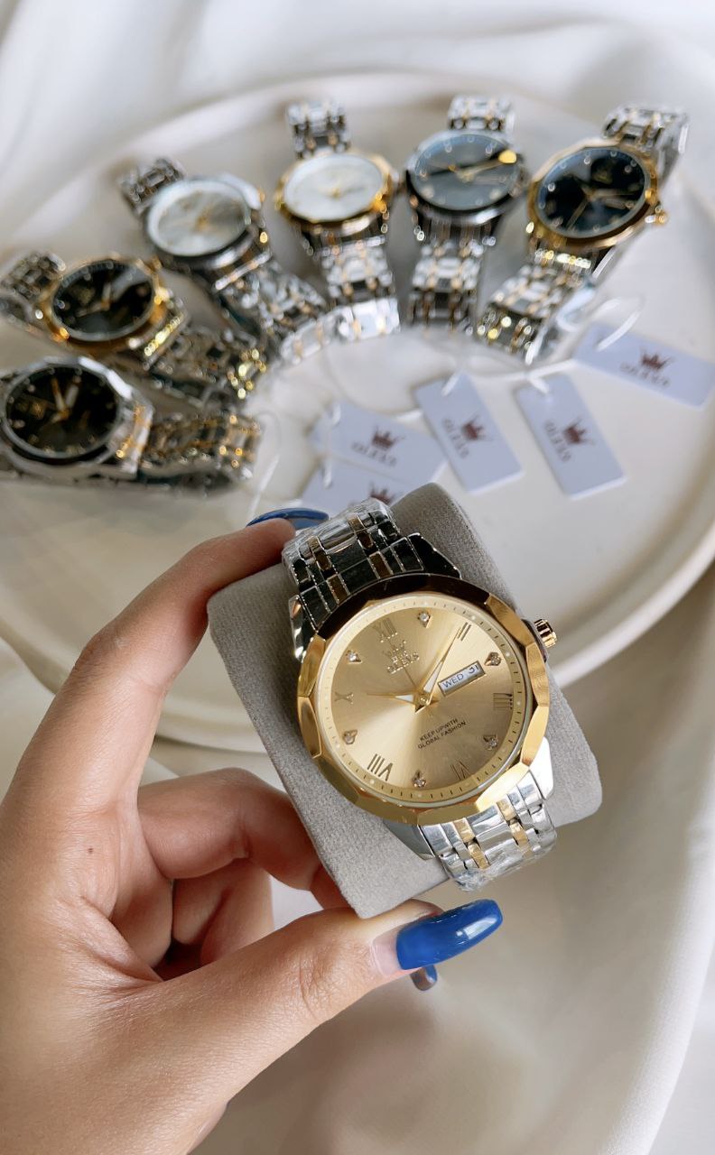 ساعت olevs الوز مردانه موتور کوارتز مقاوم در برابر آب  طرح الماس دارای روز شمار ایام هفته  صفحه شب نما بند فولاد استیل قفل پروانه ای استیل مخفی شیشه سافایر ضدخش