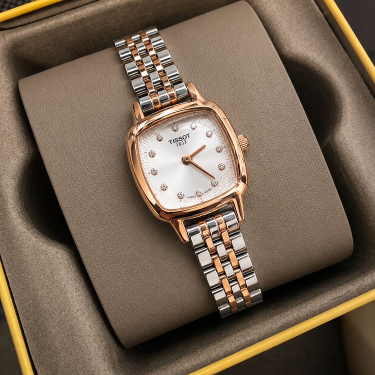 TISSOT 🔥highe quality 🫶زنونه تیسوت دویل رفرانس T 1983 قفل استیل پروانه ای مقاوم دربرابر آب صفحه نگین دار بند استیل صفحه مربعی موتور کوارتز خاص وجذاب